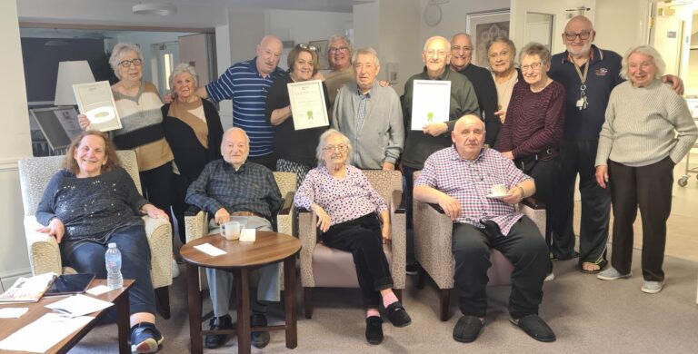 JBD's Milne Courts tenants with their certificates