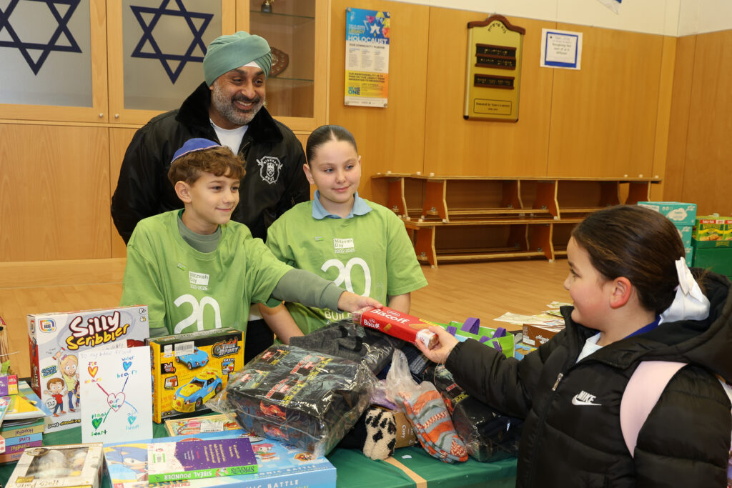 Harj Sethi from Nishkam SWAT and WIJPs' Head Boy and Girl man the collection stand