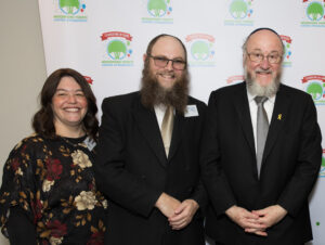 Rebbetzin Blima Wollenberg and Rabbi Mordechai Wollenberg with Chief Rabbi Ephraim Mirvis