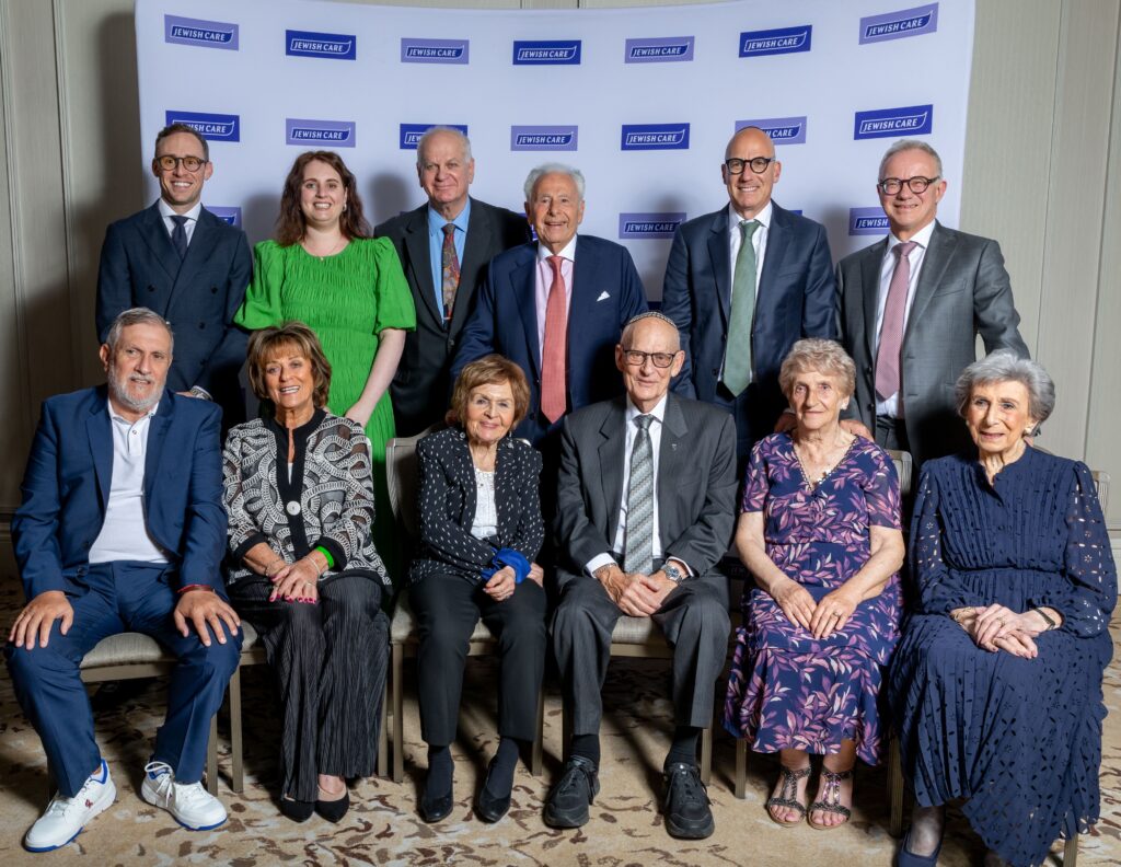 The Lord Levy, Marcus Sperber and Steven Lewis MBE with the clients who were the stars at Jewish Care's Annual Dinner